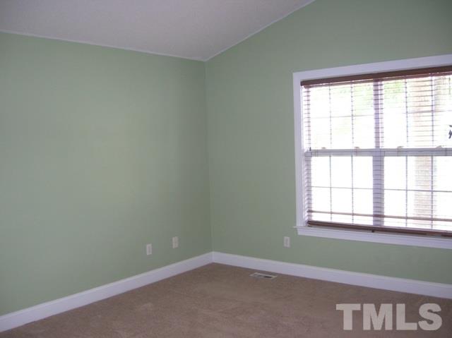 2695 Highway 42 Willow Spring, NC 27592 - Photo 11 of 22 an empty room with a window