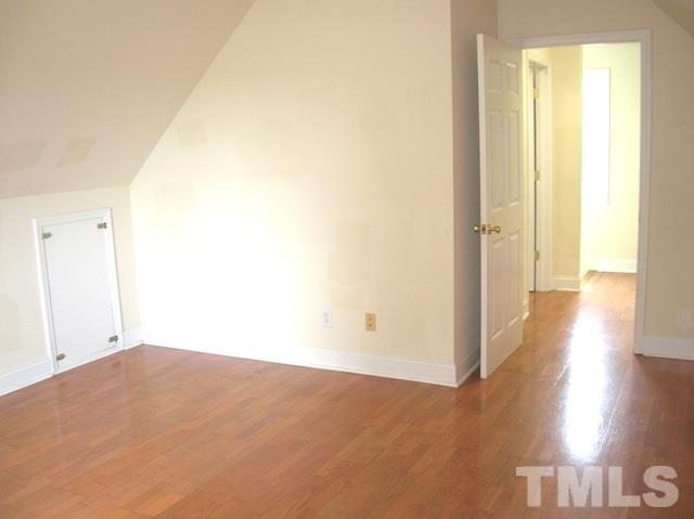 2695 Highway 42 Willow Spring, NC 27592 - Photo 15 of 22 a view of an empty room and wooden floor