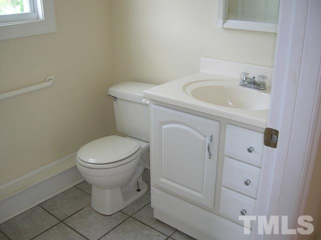2695 Highway 42 Willow Spring, NC 27592 - Photo 17 of 22 a white toilet sitting next to a bathroom sink