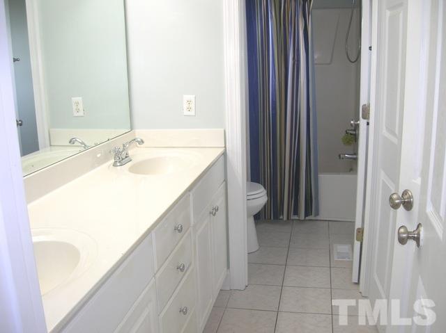 2695 Highway 42 Willow Spring, NC 27592 - Photo 9 of 22 a bathroom with a sink and a mirror