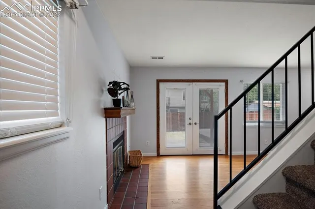 a view of a kitchen with cabinets stainless steel appliances and a window