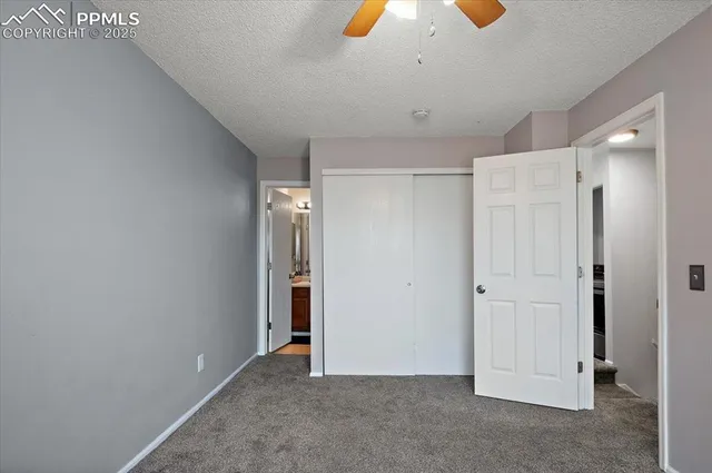 a bathroom with a sink a toilet a mirror and shower curtain