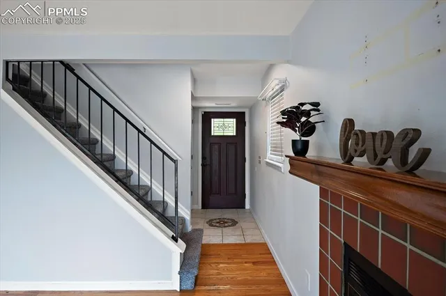 a hallway with a dining table and chairs