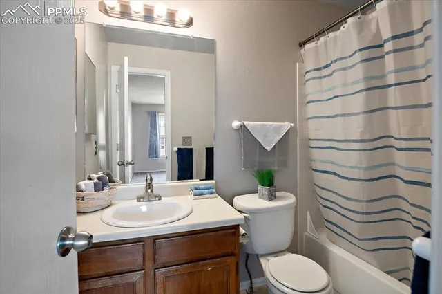 a bedroom with a large bed and a tv