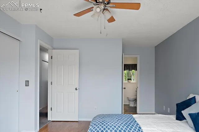 a bathroom with a toilet a sink and window