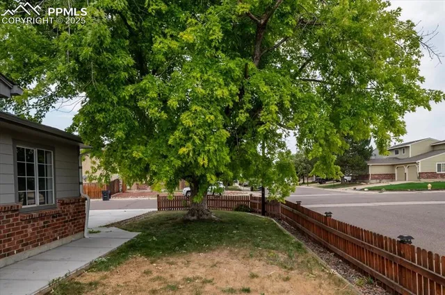a view of a house with backyard porch and sitting area