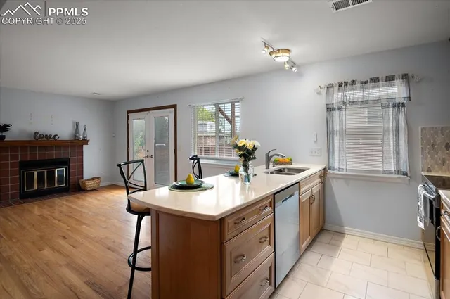 a kitchen with a sink cabinets and window