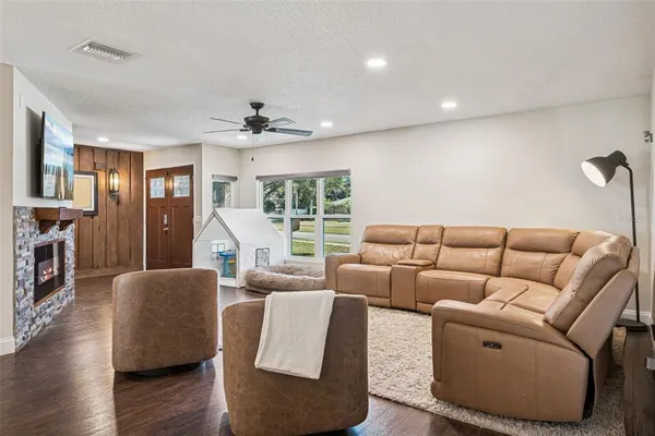 a living room with furniture and a large window