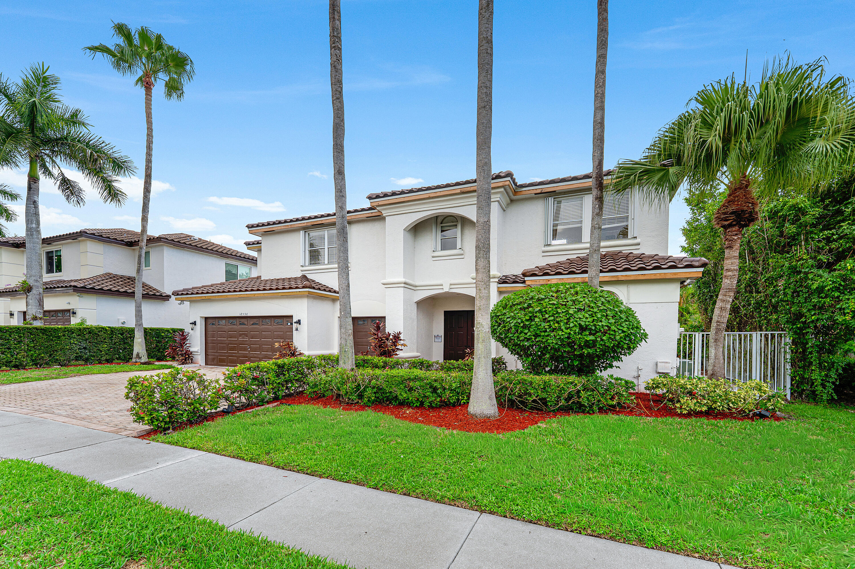 18596 Ocean Mist Drive Boca Raton, FL 33498 - Photo 2 of 51 Lushly Landscaped Exterior