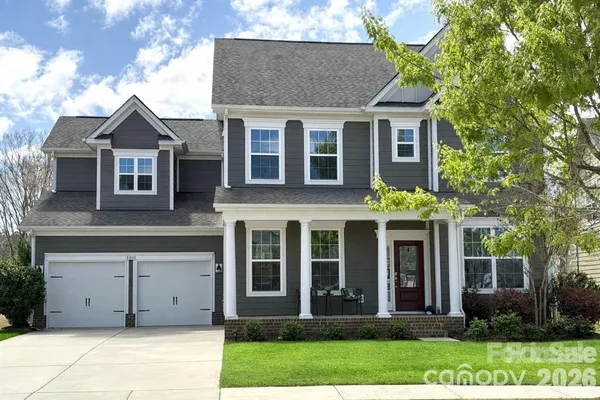 front view of a house with a yard