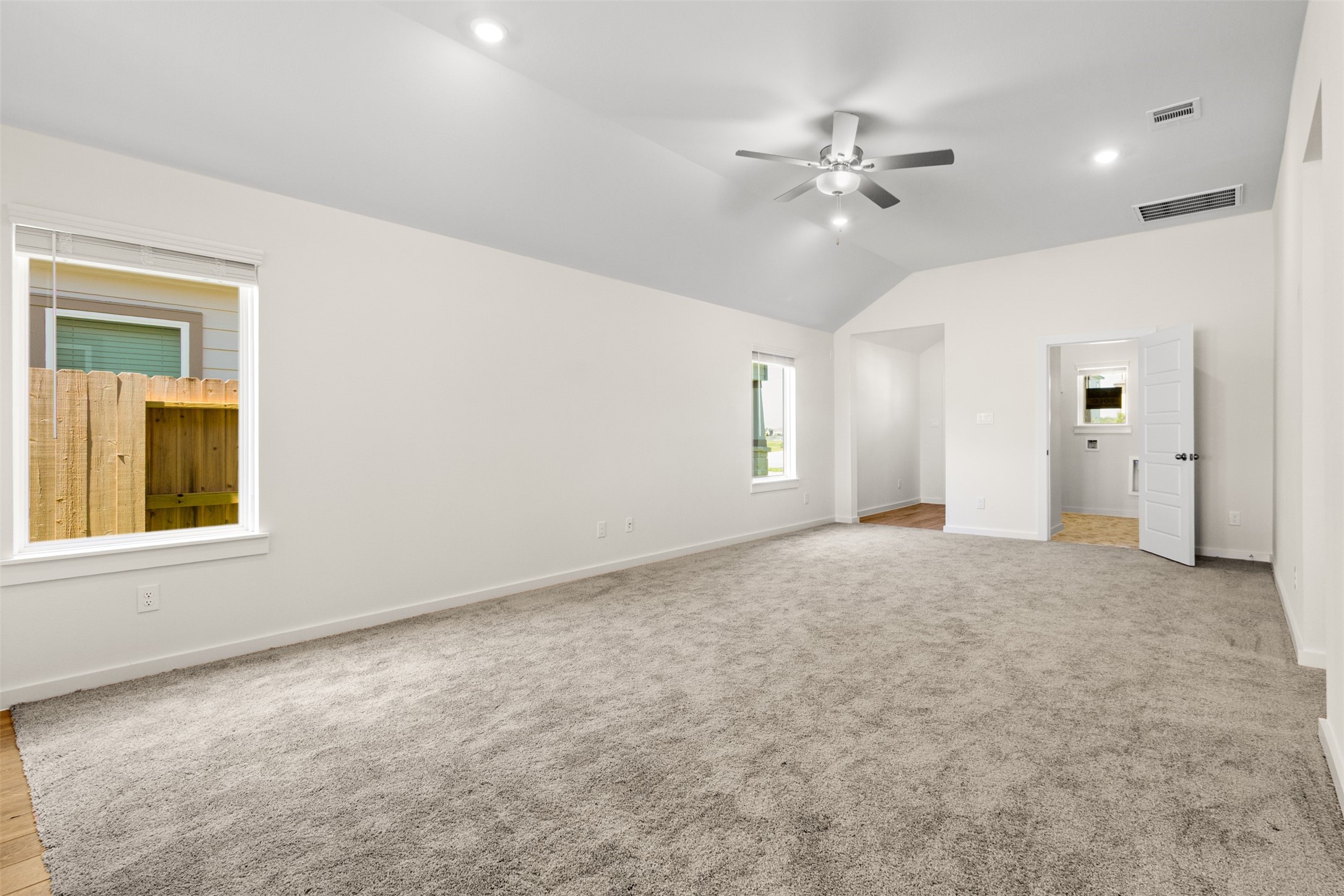 6643 Escondido Drive Rosharon, TX 77583 - Photo 5 of 25 an empty room with fan and windows