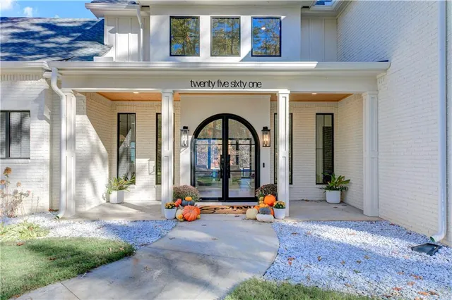 a large kitchen with a table and chairs