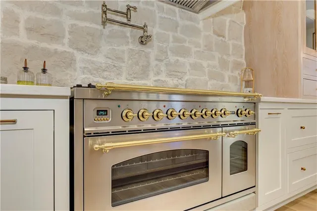 a bathroom with a granite countertop sink toilet a mirror and shower