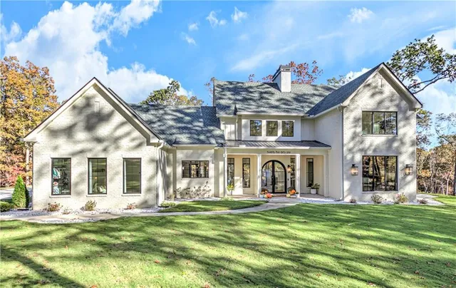 front view of a house with a yard