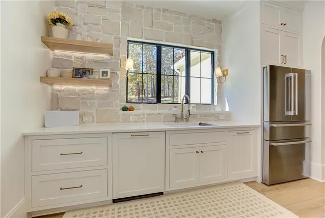 a bedroom with a bed and a potted plant