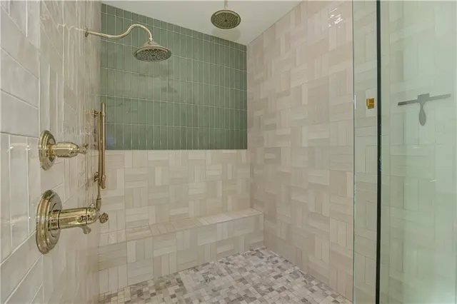 a view of a backyard with plants and large trees