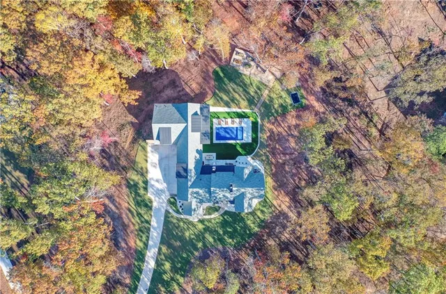 a living room with furniture large window and a fireplace