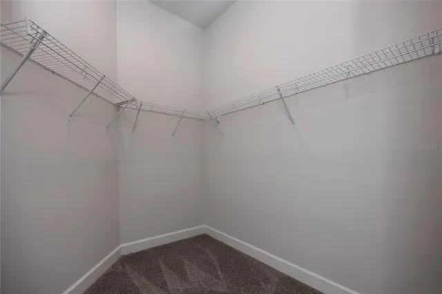 a bathroom with a shower a toilet and a sink