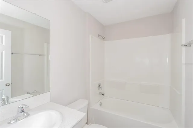 a bathroom with a bathtub and a sink