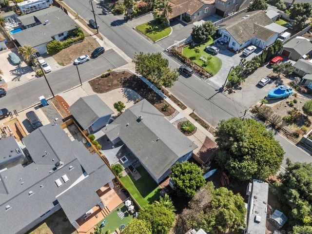 an aerial view of a house with outdoor space