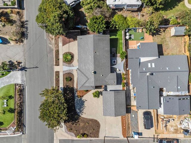 a spacious bedroom with a bed and a window