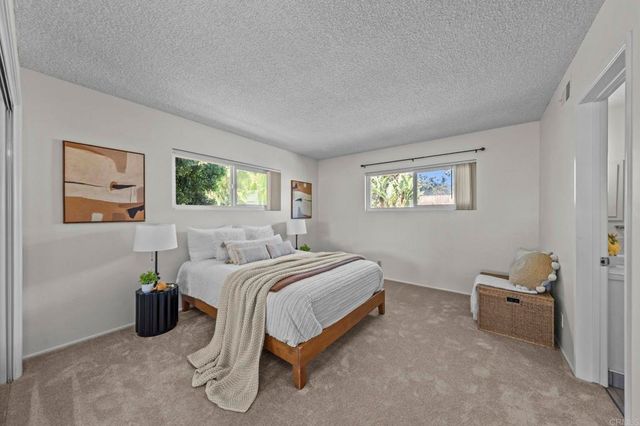 a bedroom with a bed and furniture