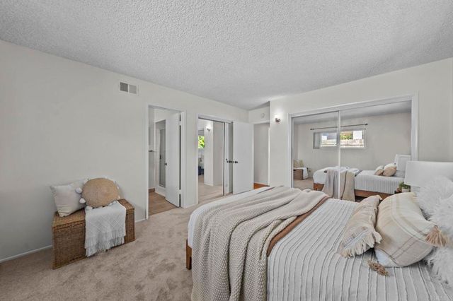 a bathroom with a shower sink and mirror