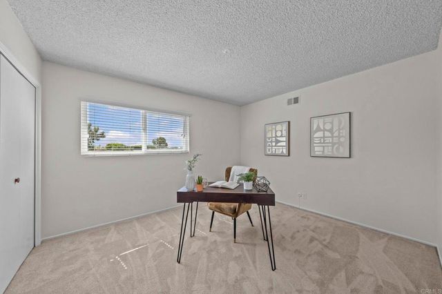 a view of a room with a table and chair