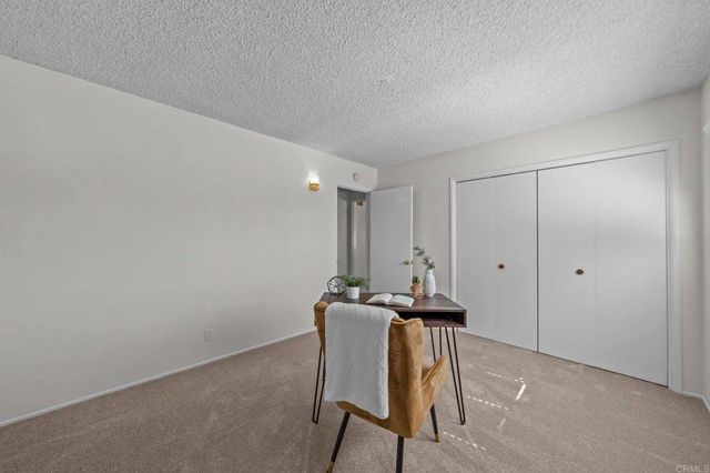 a view of a house with a yard and garage