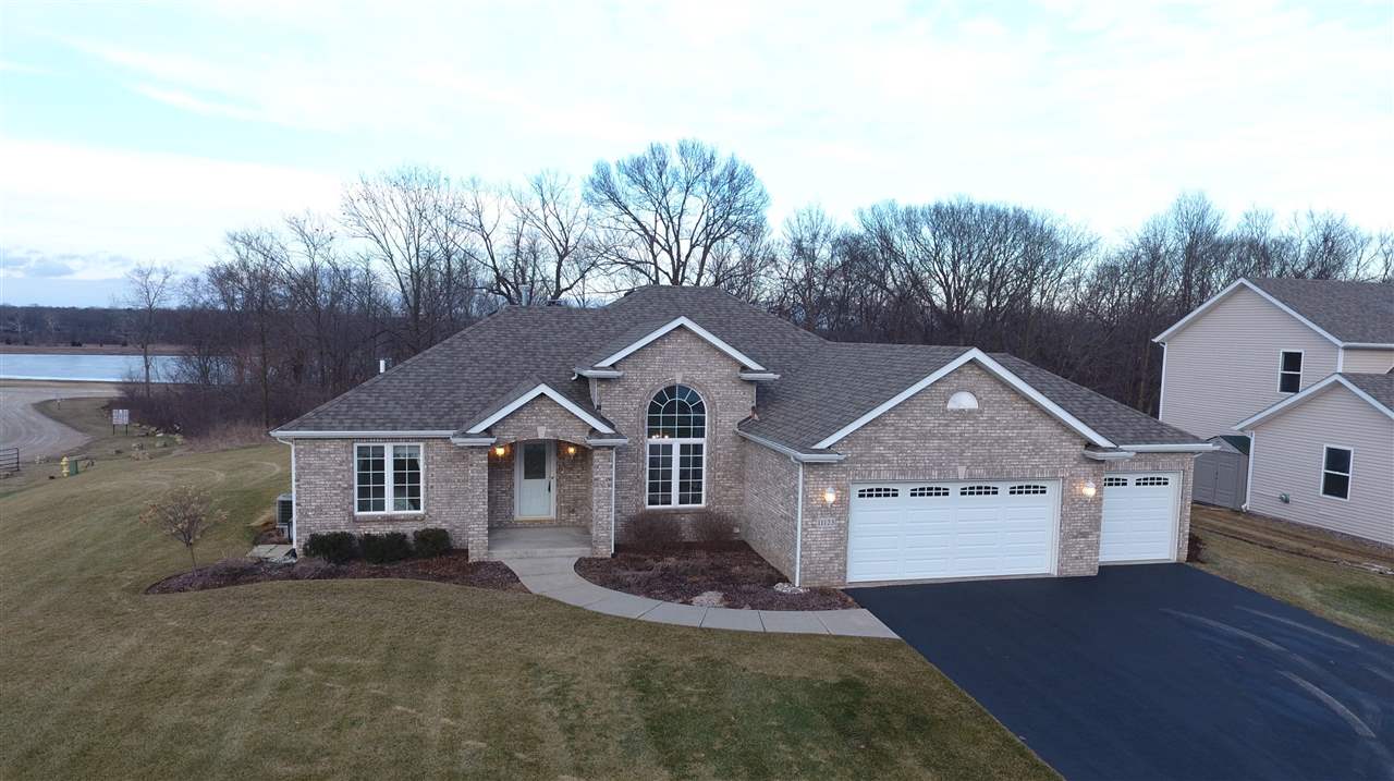 11123 Chicory Ridge Way Roscoe, IL 61073 - Photo 1 of 23 front view of a house with a yard
