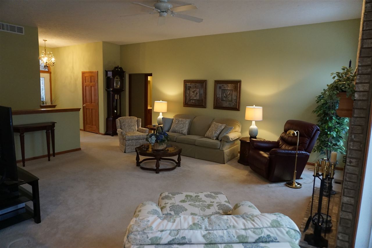 11123 Chicory Ridge Way Roscoe, IL 61073 - Photo 3 of 23 a living room with furniture and a fireplace