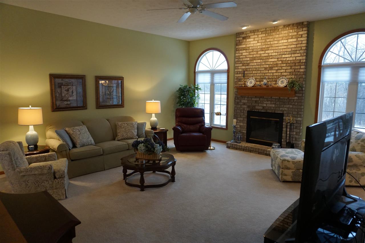 11123 Chicory Ridge Way Roscoe, IL 61073 - Photo 5 of 23 a living room with furniture and a fireplace