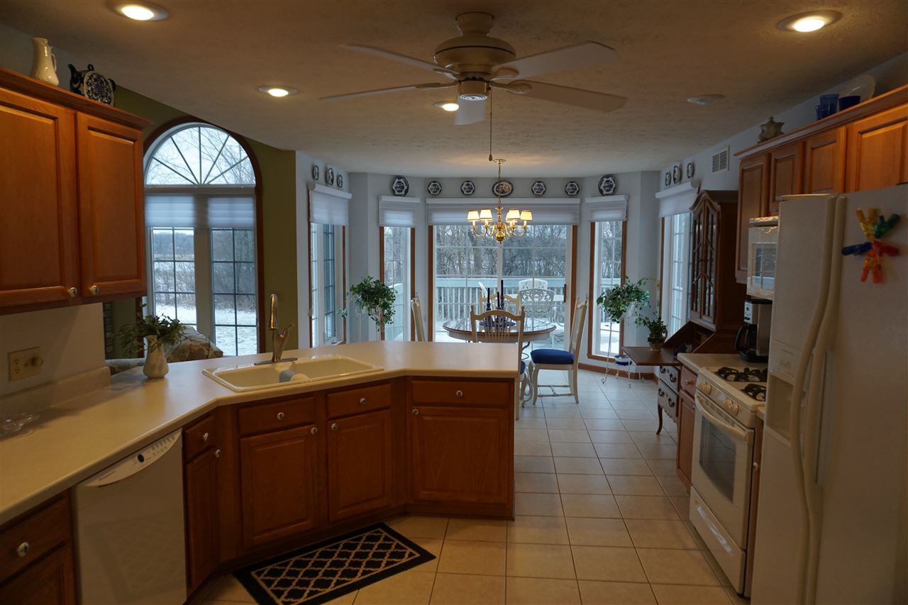 11123 Chicory Ridge Way Roscoe, IL 61073 - Photo 6 of 23 a kitchen with a sink stainless steel appliances and cabinets