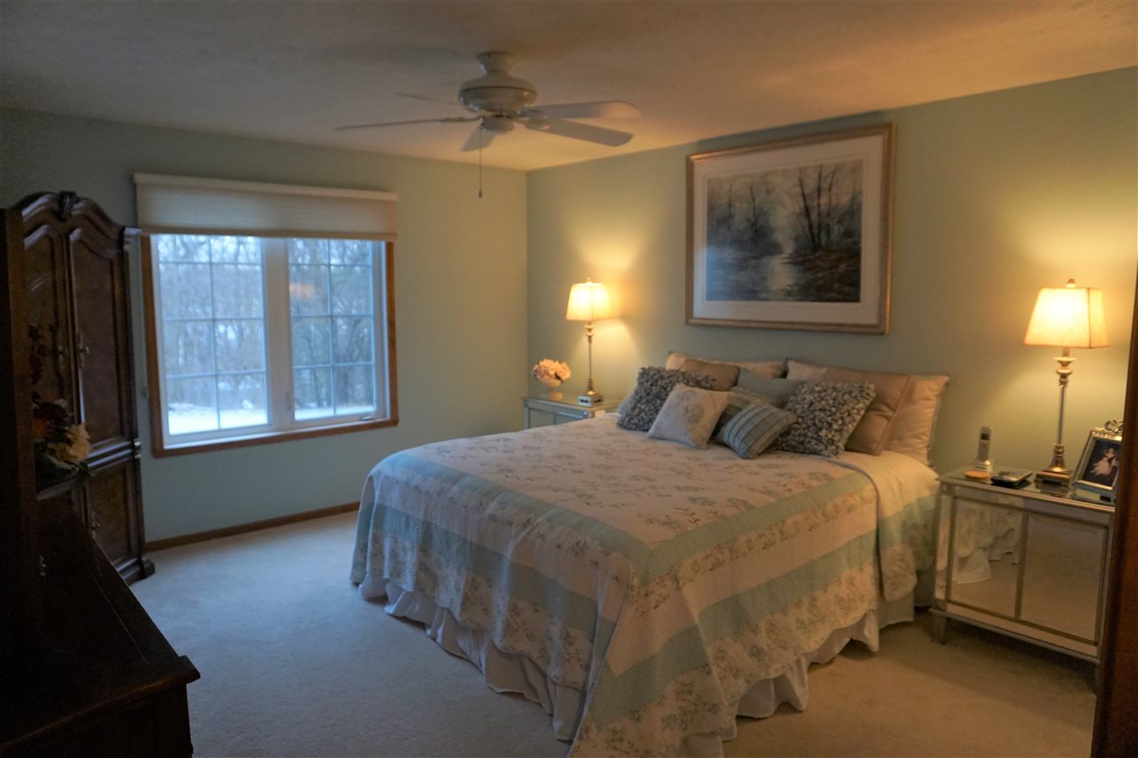 11123 Chicory Ridge Way Roscoe, IL 61073 - Photo 8 of 23 a bed room with a bed and a window
