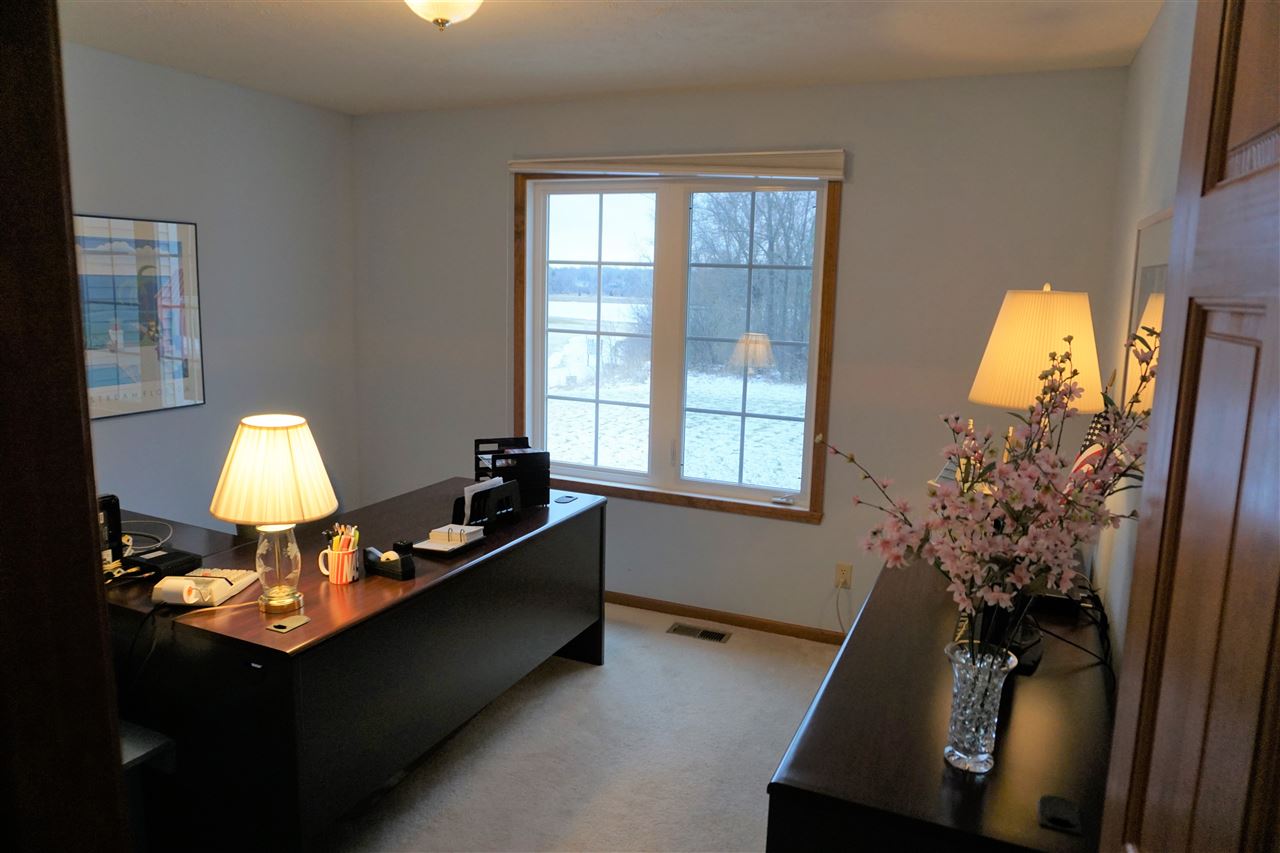 11123 Chicory Ridge Way Roscoe, IL 61073 - Photo 9 of 23 a room with a bed and a potted plant