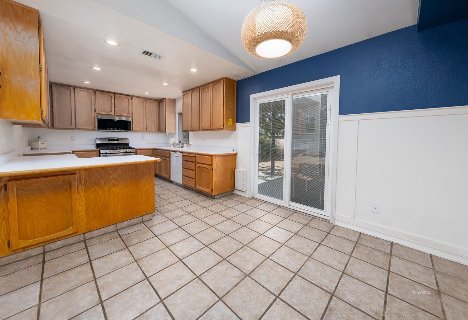 424 Olive Avenue Ridgecrest, CA 93555 - Photo 6 of 46 a kitchen with stainless steel appliances a refrigerator sink and cabinets
