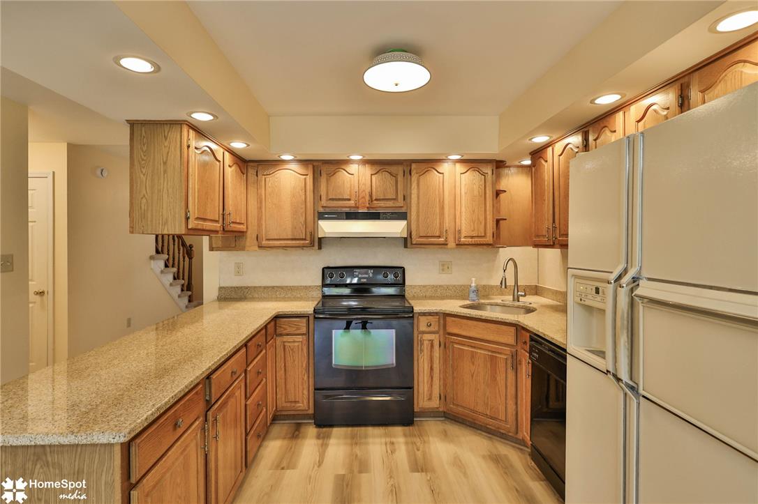 4059 Wedgewood Road Allentown, PA 18104 - Photo 16 of 72 A well-equipped kitchen boasts ample cabinet storage and granite-look countertops, ready for daily culinary endeavors.
