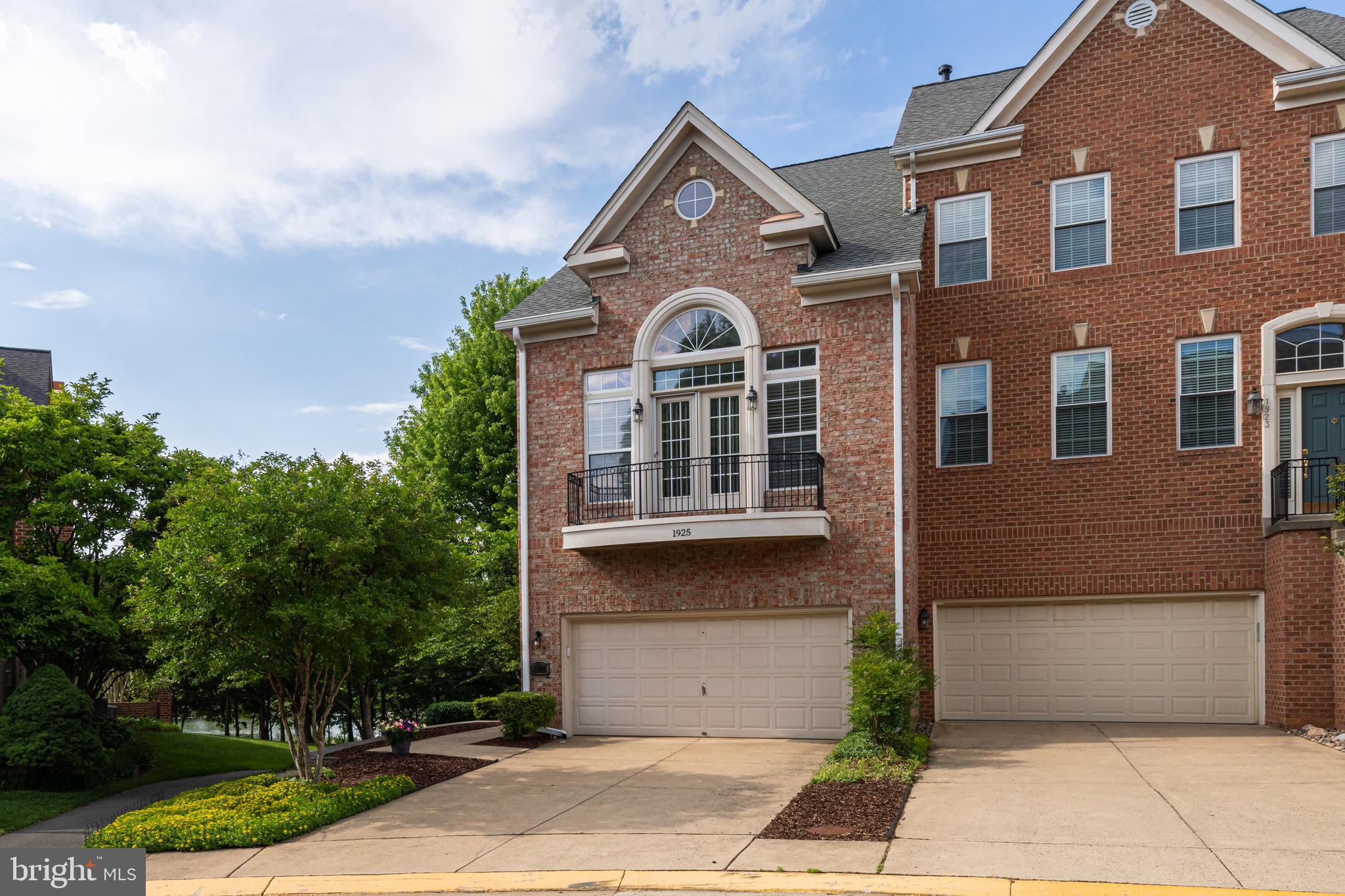 1925 Logan Manor Drive Reston, VA 20190 - Photo 3 of 61 a front view of a house with a garden