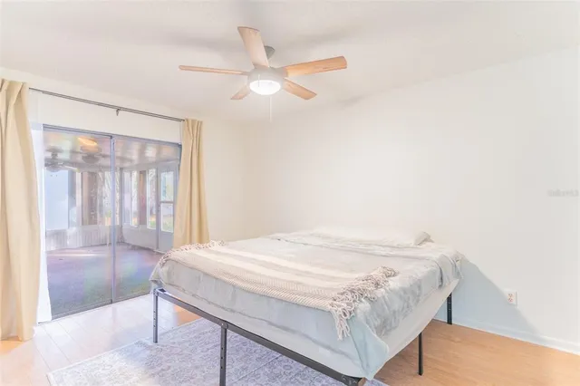 a bed sitting in a room next to a window