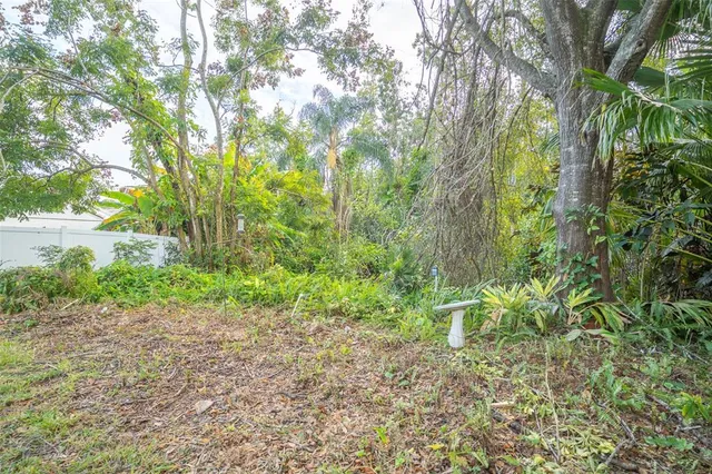 an aerial view of a house having yard and patio