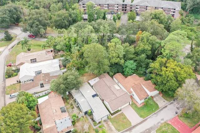 an aerial view of a residential apartment building with a yard