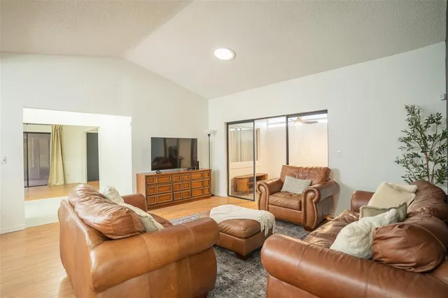 a living room with furniture or couch and a flat screen tv