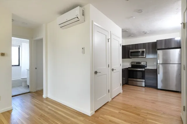 a kitchen with a refrigerator and a sink