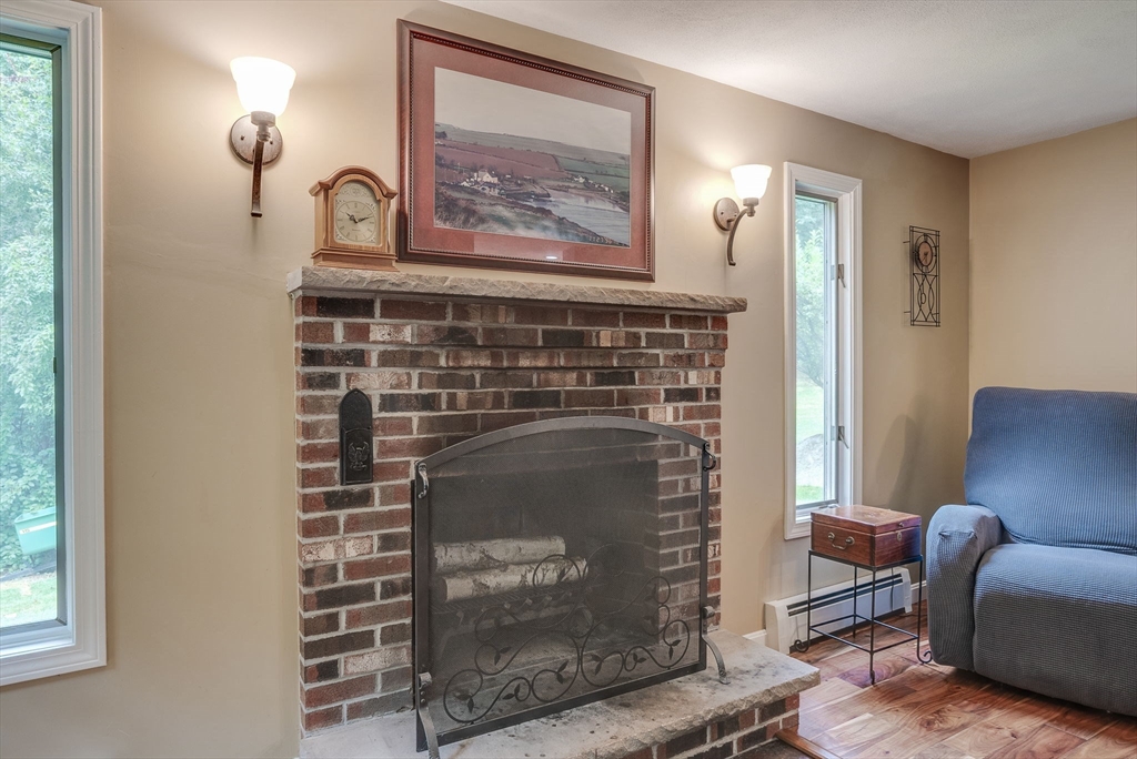 26 Parish Road Georgetown, MA 01833 - Photo 14 of 39 a living room with furniture and a fireplace