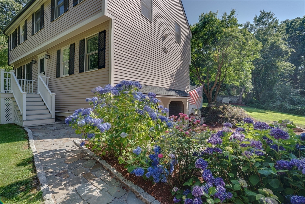 26 Parish Road Georgetown, MA 01833 - Photo 2 of 39 a view of a house with a yard and garden