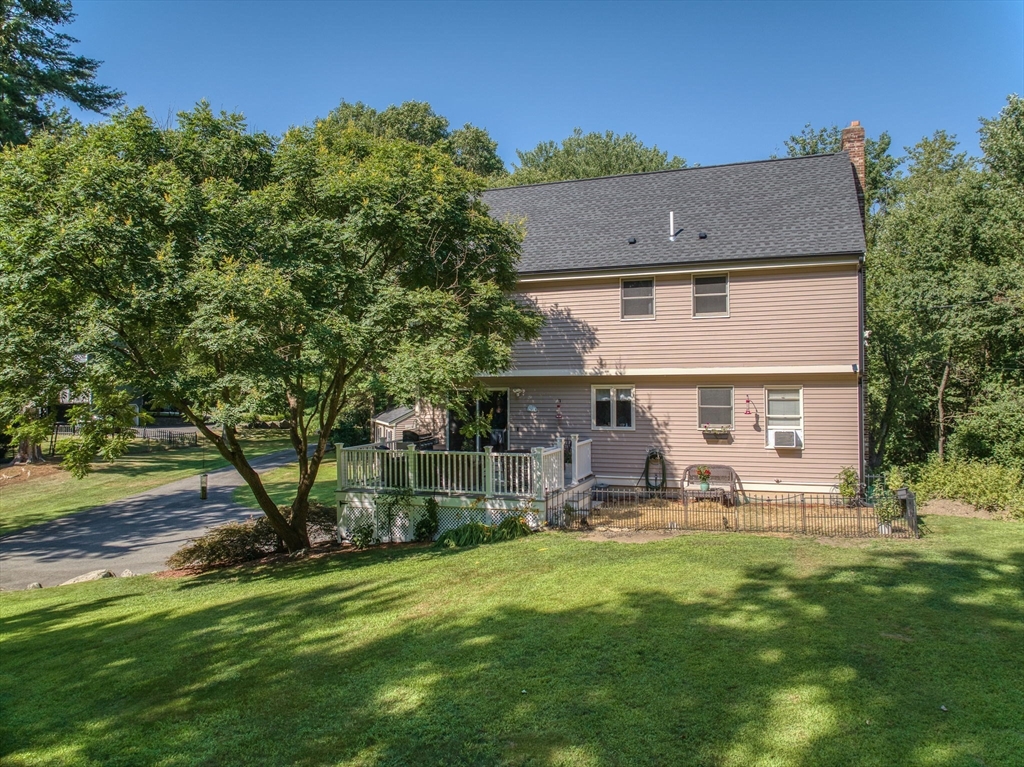 26 Parish Road Georgetown, MA 01833 - Photo 29 of 39 a view of a house with a yard