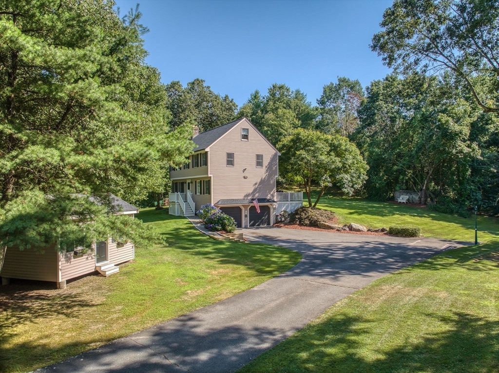 26 Parish Road Georgetown, MA 01833 - Photo 3 of 39 a view of a house with swimming pool and sitting area