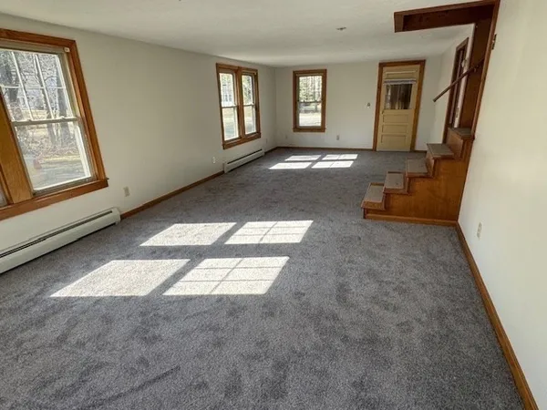 a view of livingroom with furniture and window