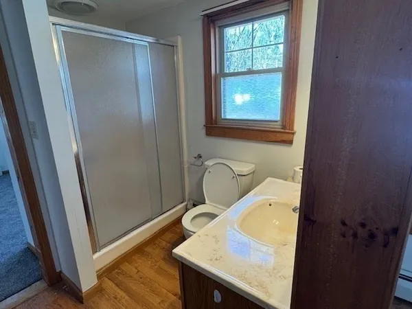 a bathroom with a sink a mirror and a shower