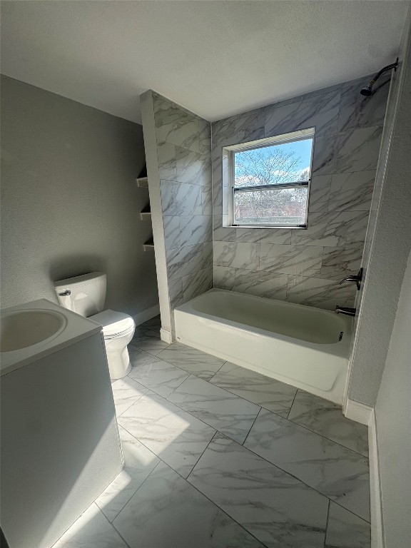 512 Rice Street Angleton, TX 77515 - Photo 11 of 12 a view of a bathroom with a bathtub and toilet